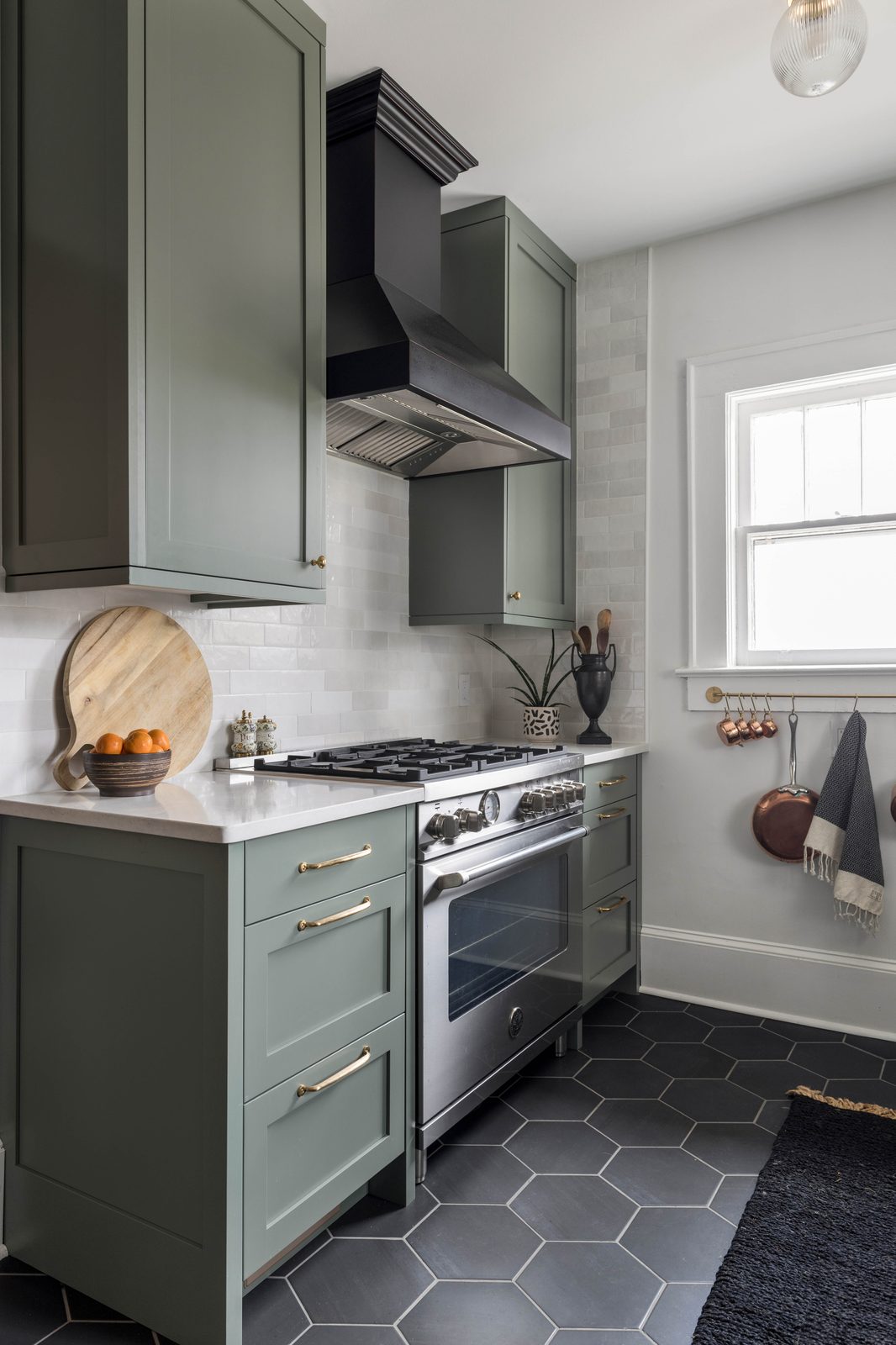 Editorial interior photograph of a kitchen with warm natural light, styled details, and material textures, produced for an interior designer's portfolio and publication submission.
