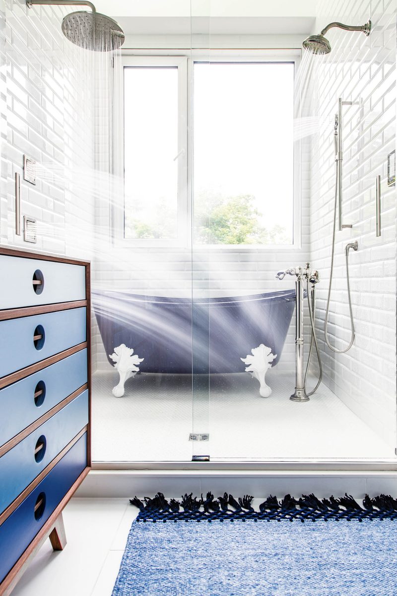 Vertical interior photograph of a main-bathroom wet room, the orientation editors need for shelter-magazine cover and lead-feature placements.