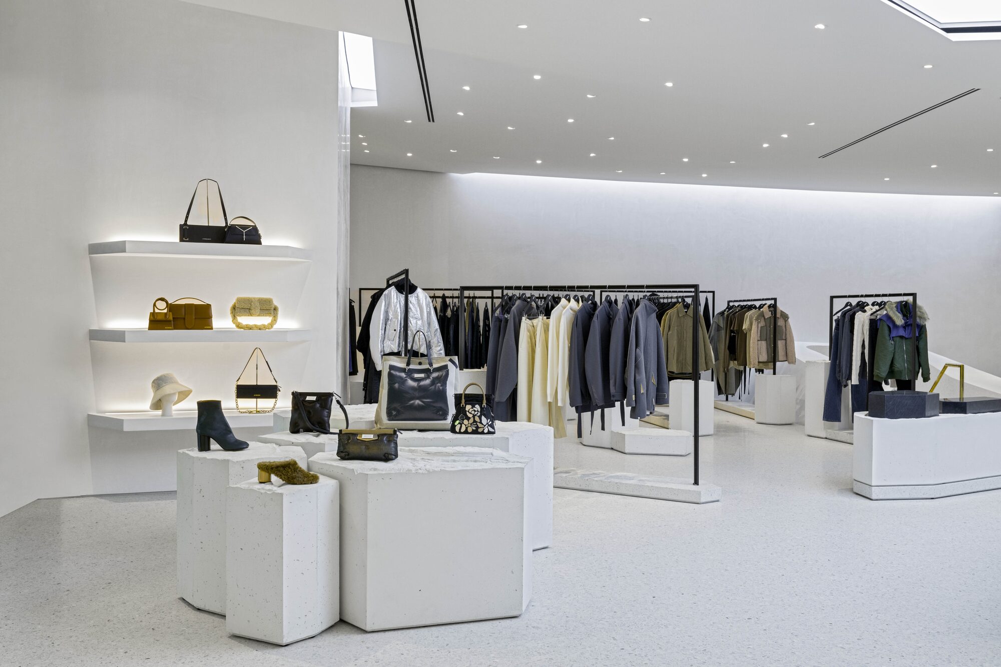 Luxury fashion retail accessories display in minimalist interior